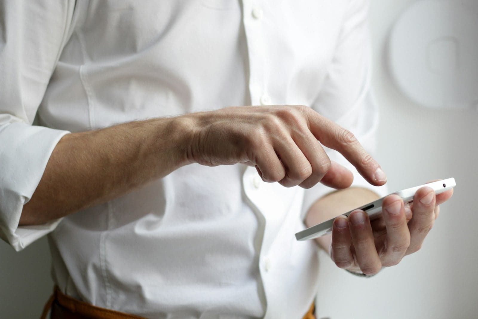 Person using an Android phone on public Wi-Fi in a cafe