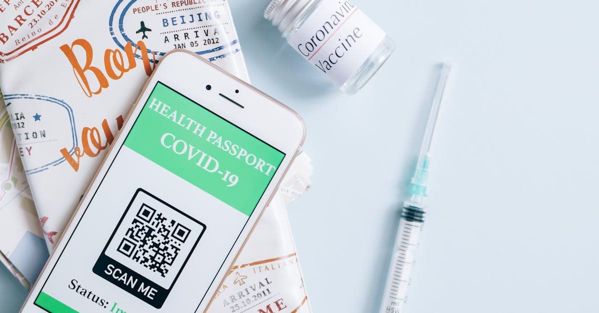 Image of a smartphone displaying a COVID-19 health passport next to a vaccine vial and syringe, ready for travel.