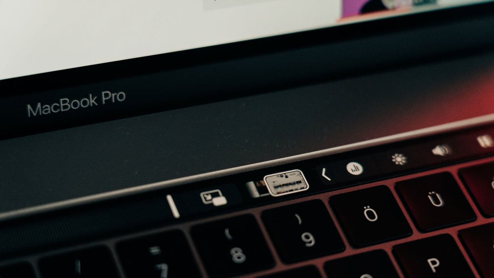 Detailed clo e-up of a MacBook Pro keyboard featuring the innovative touch bar technology.