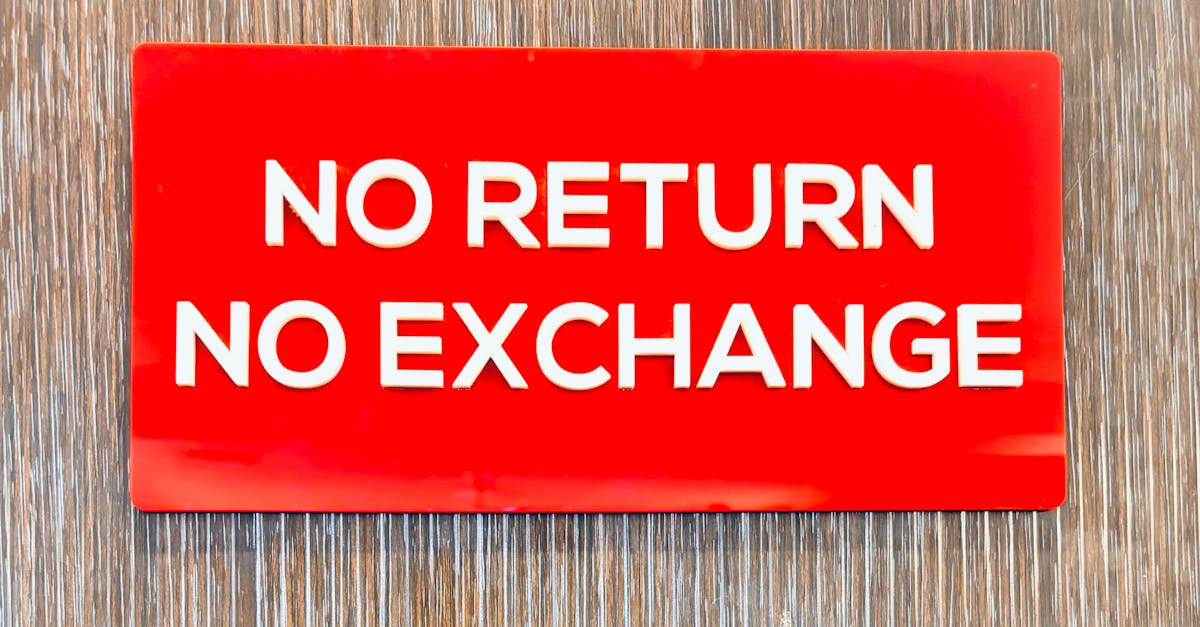Bold red sign with 'No Return No Exchange' message on a wooden backdrop.
