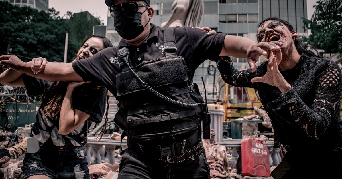 Urban apocalypse scene with people in zombie makeup and tactical gear in Mexico City.
