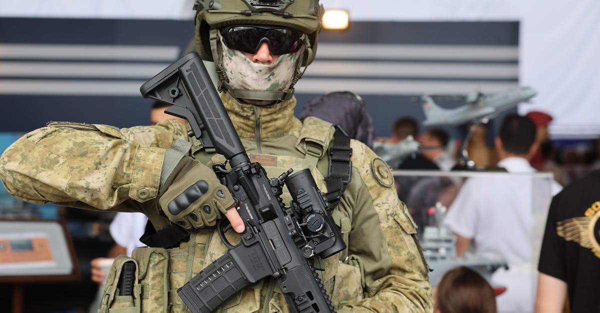 Armed soldier in tactical gear holding a rifle at a public event in İzmir, Türkiye.