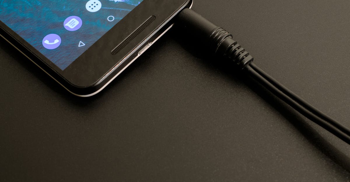 Close-up of a smartphone being charged, displaying a modern interface on a dark backdrop.