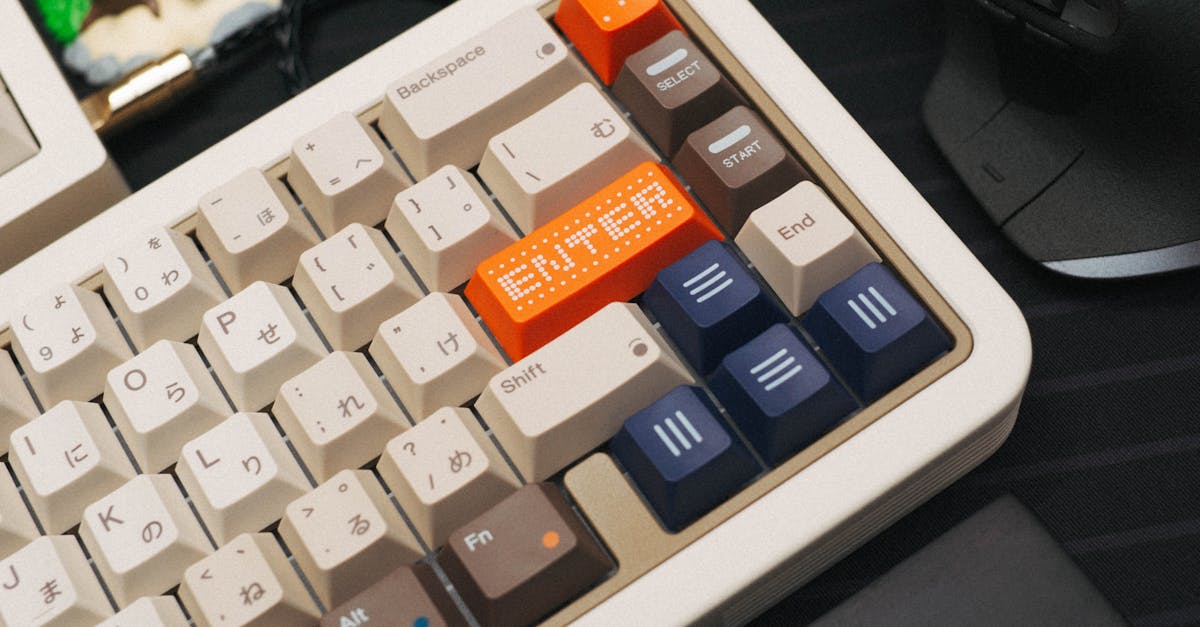 Close-up of a retro-style mechanical keyboard featuring an LED-illuminated Enter key in a creative office setting.