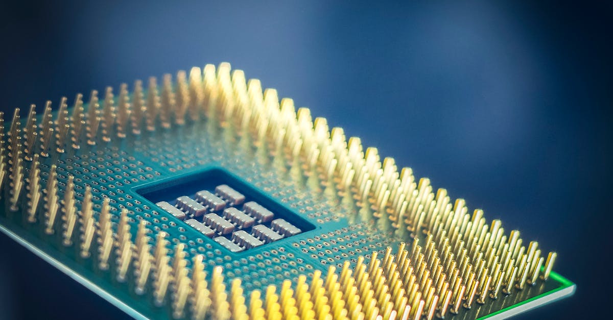 High-resolution macro shot of a computer CPU chip with gold pins against a blue background.