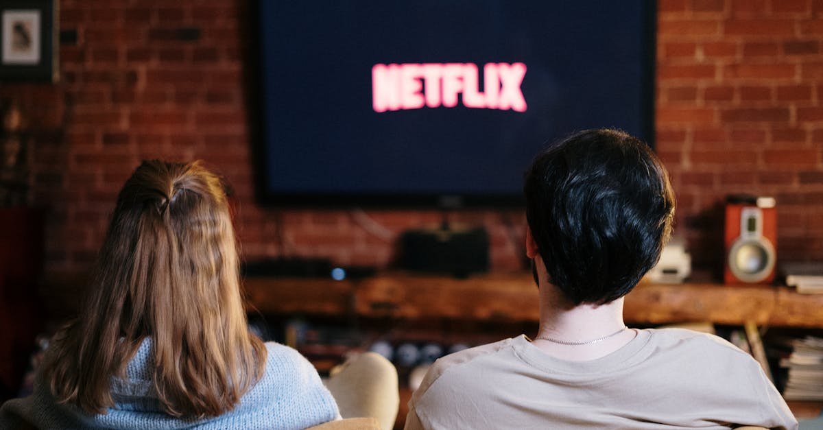 A couple enjoys a relaxed evening watching Netflix in their living room.