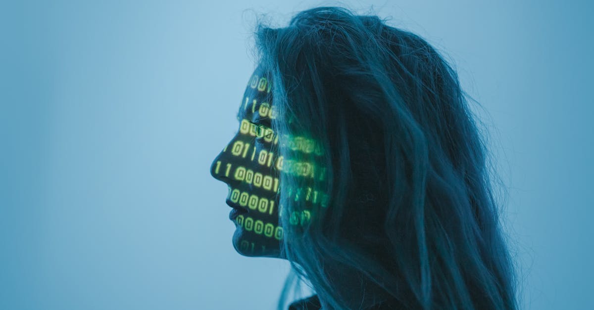 Silhouette of a woman with binary code projected on her face in a digital concept setting.