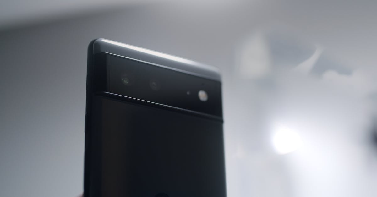 Detailed view of a sleek smartphone focusing on its camera lenses and modern design.