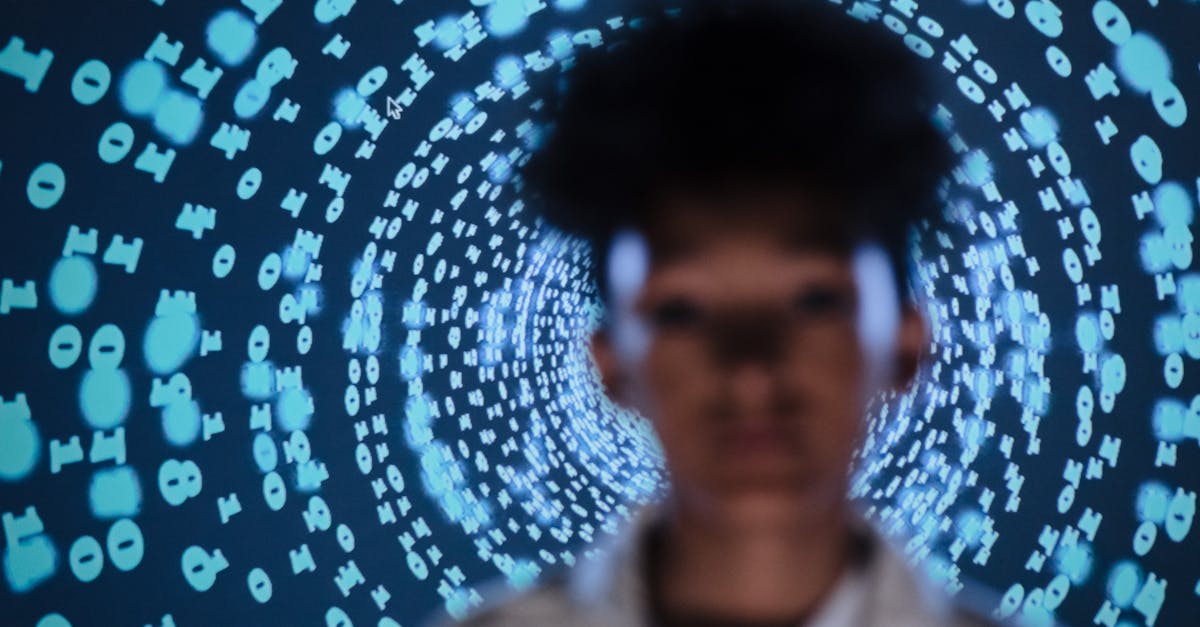 Blurred person in front of a digital code projection creating a tech-inspired abstract vibe.